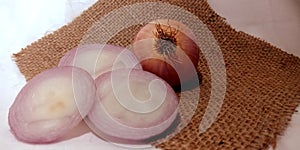 Fresh organic produce onion isolated on grey mat