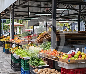 Fresh organic produce on sale at the local farmers market. Counter with fresh vegetables