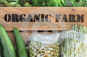 Fresh organic produce in wooden box