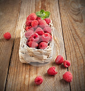 Fresh organic raspberry in basket.