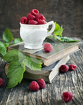 Fresh organic raspberry in cup.