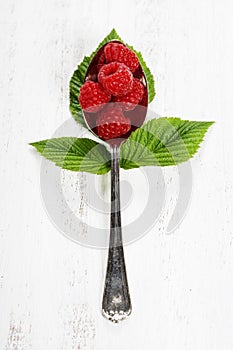 Fresh organic raspberry in a spoon. Selective focus
