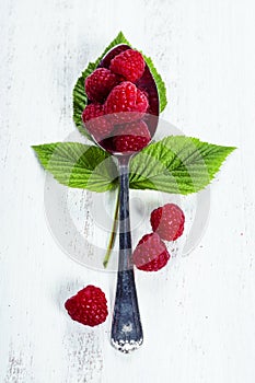 Fresh organic raspberry in a spoon. Selective focus