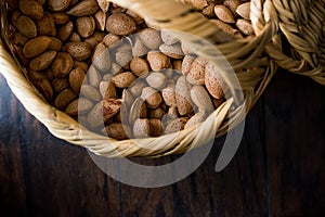 Fresh Organic Raw Almonds with Shell in Basket.