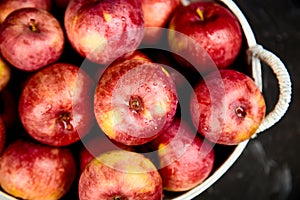 Fresh organic red apples in a basket