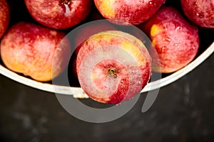 Fresh organic red apples in a basket