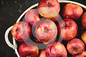 Fresh organic red apples in a basket