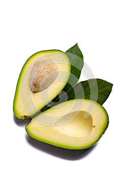 Fresh organic ripe green whole and sliced Fuerte avocado with le photo