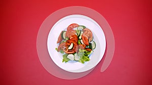 Fresh organic salad on white plate bright background, healthy nutrition, lunch