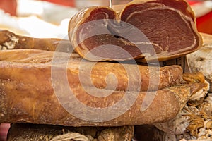 Fresh organic salami in basket on local market in France