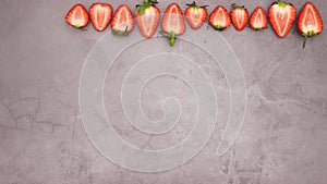 Fresh and organic strawberries appear on top of background - Stop motion looping