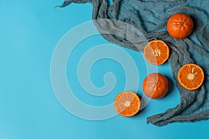 Fresh, organic tangerines on a blue background