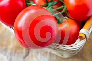 Fresh organic tomatoes in a basket. Close up