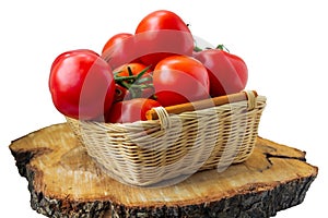 Fresh organic tomatoes in a basket isolated on white.. Close up