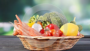 Fresh organic vegetables in basket on table and blur background, Healthy food concept.