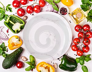 Fresh Organic Vegetables frame around an empty plate. Healthy food or diet concept