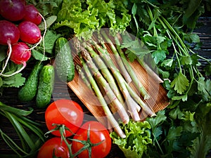 Fresh organic vegetables healthy assortment kitchen bio vegetarian on a wooden background, tomato