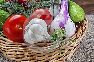 Fresh organic vegetables tomatoes, onions, cucumbers and garlic