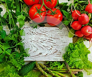 Fresh organic vegetables on a wooden background