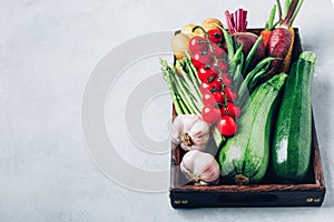 Fresh organic vegetables in a wooden box