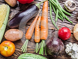 Fresh organic vegetables on the wooden table.