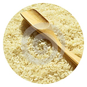 Fresh organic white raw rice grains texture and wooden spoon, uncooked rice background