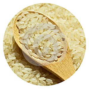 Fresh organic white raw rice grains texture and wooden spoon, uncooked rice background