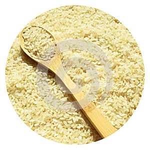 Fresh organic white raw rice grains texture and wooden spoon, uncooked rice background