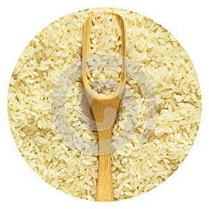 Fresh organic white raw rice grains texture and wooden spoon, uncooked rice background