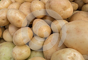 Fresh organic young potatoes sold on market