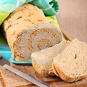 Fresh from the oven gluten free bread on a cutting board