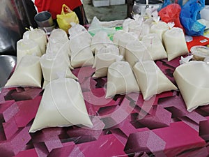 Fresh packed in plastic bags soya bean juice.