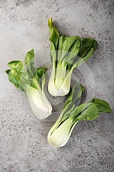 Fresh pak choi cabbage on  grey background
