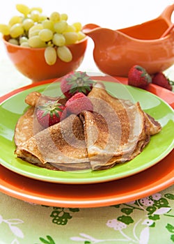 Fresh pancakes (blini) with strawberries