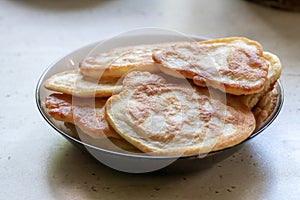 fresh pancakes on a glass dish. authentic homemade food. background backdrop