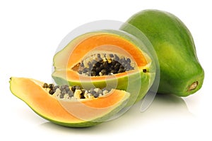 Fresh papaya fruit and a cut one