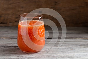 Fresh papaya smoothie juice in glass