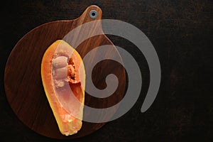 Fresh papaya on a wooden background