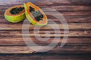 Fresh papaya on wooden background