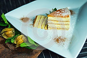 Fresh passion fruit cake with coconut and cinnamon. Dessert on plate. The restaurant or cafe atmosphere