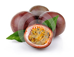Fresh passion fruit with green leaves isolated