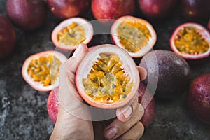 Fresh passion fruits on dark background