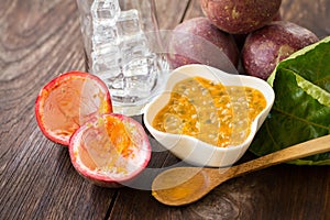 Fresh passion fruits on a wooden background