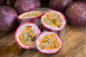 Fresh passion fruits on a wooden background