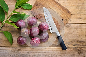 Fresh passion fruits on a wooden background