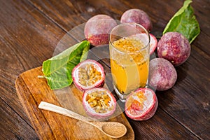 Fresh passion fruits on a wooden background