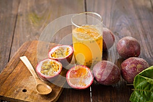 Fresh passion fruits on a wooden background