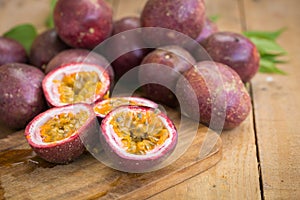 Fresh passion fruits on a wooden background