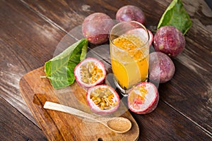 Fresh passion fruits on a wooden background