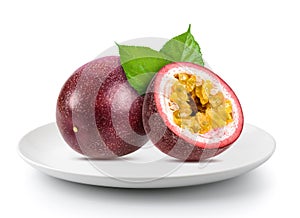 Fresh passionfruits in plate on a white background